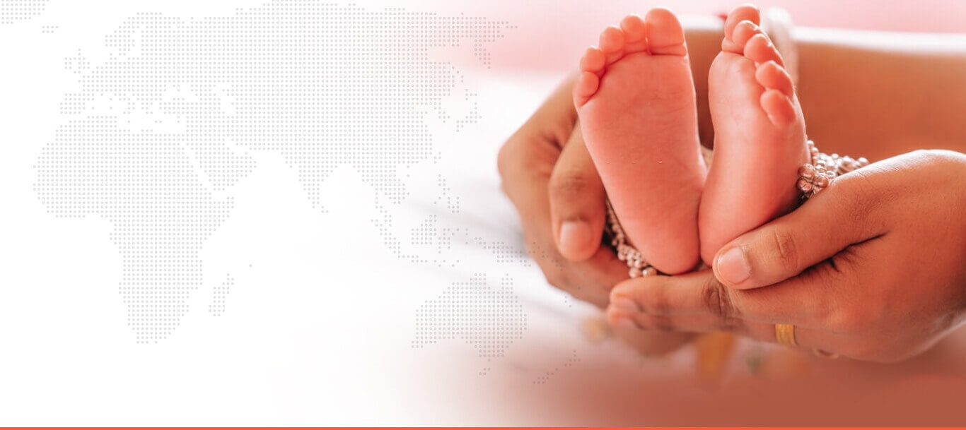 Newborn baby legs in hands