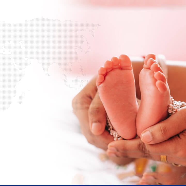 Newborn baby legs in hands